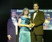 11 November 2006; Cork's Anna Geary receives her All-Star award from Tadhg Kennelly, footballer with the Sydney Swans, in the company of Liz Howard, President, Cumann Camogaiochta na nGael, speaking at the 2006 Camogie All-Star Awards. Citywest Hotel, Dublin. Picture credit: Brendan Moran / SPORTSFILE
