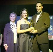11 November 2006; Wexford's Kate Kelly receives her All-Star award from Tadhg Kennelly, footballer with the Sydney Swans, in the company of Liz Howard, President, Cumann Camogaiochta na nGael, speaking at the 2006 Camogie All-Star Awards. Citywest Hotel, Dublin. Picture credit: Brendan Moran / SPORTSFILE