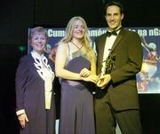 11 November 2006; Tipperary's Joanne Ryan receives her All-Star award from Tadhg Kennelly, footballer with the Sydney Swans, in the company of Liz Howard, President, Cumann Camogaiochta na nGael, speaking at the 2006 Camogie All-Star Awards. Citywest Hotel, Dublin. Picture credit: Brendan Moran / SPORTSFILE