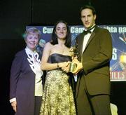 11 November 2006; Kilkenny's Imelda Kennedy receives her All-Star award from Tadhg Kennelly, footballer with the Sydney Swans, in the company of Liz Howard, President, Cumann Camogaiochta na nGael, speaking at the 2006 Camogie All-Star Awards. Citywest Hotel, Dublin. Picture credit: Brendan Moran / SPORTSFILE