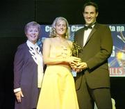 11 November 2006; Galway's Veronica Curtin receives her All-Star award from Tadhg Kennelly, footballer with the Sydney Swans, in the company of Liz Howard, President, Cumann Camogaiochta na nGael, speaking at the 2006 Camogie All-Star Awards. Citywest Hotel, Dublin. Picture credit: Brendan Moran / SPORTSFILE