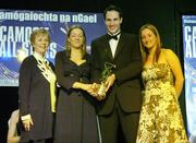11 November 2006; Maria Dargan, 2nd from left, from Kilkenny, who received the Young Player of the Year award, from Guest of Honour and Sydney Swans footballer Tadhg Kennelly, in the company of Liz Howard, President, Cumann Camogaiochta na nGael and Cork captain Joanne O'Callaghan at the 2006 Camogie All-Star Awards. Citywest Hotel, Dublin. Picture credit: Brendan Moran / SPORTSFILE