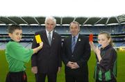 14 November 2006; President of the GAA, Mr. Nickey Brennan and Chairman of the Referee's Committee, Mr. P.J. McGrath are shown the yellow and red card by Cumann na mBunscoil young whislers Dean Fitzpatrick and Nicola Carroll at the launch of the new refereeing initiative - the National Referee Recruitment Campaign. Croke Park, Dublin. Picture credit: Damien Eagers / SPORTSFILE