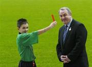 14 November 2006; President of the GAA Mr. Nickey Brennan is shown the red card by Allianz Cumann na mBunscoil young whistler Dean Fitzpatrick as they attend the launch of the new refereeing initiative - the National Referee Recruitment Campaign. Croke Park, Dublin. Picture credit: Damien Eagers / SPORTSFILE