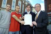 16 November 2006; FAI Chief Executive Officer, John Delaney, and PFAI General Secretary, Fran Gavin, right, with Shelbourne players Owen Heary, left, and Sean Dillon, showing a copy of the standard player contract, after a joint press conference by the Football Association of Ireland and the Professional Footballers' Association of Ireland to announce three major initiatives designed to improve the welfare of professional Irish players. Alexander Hotel, Dublin. Picture credit: Brian Lawless / SPORTSFILE