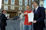 16 November 2006; FAI Chief Executive Officer, John Delaney, and Shelbourne's Sean Dillon, showing a copy of the standard player contract, while PFAI General Secretary, Fran Gavin, left, and Shelbourne captain Owen Heary practice their skills, after a joint press conference by the Football Association of Ireland and the Professional Footballers' Association of Ireland to announce three major initiatives designed to improve the welfare of professional Irish players. Alexander Hotel, Dublin. Picture credit: Brian Lawless / SPORTSFILE