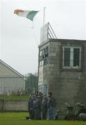 19 November 2006; Spectators shelter from the wind and rain during the game between Toomevara and Mount Sion. AIB Munster Senior Club Hurling Championship Semi-Final, Toomevara v Mount Sion, Nenagh, Co. Tipperary. Picture credit: Matt Browne / SPORTSFILE