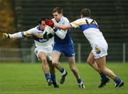 19 November 2006; Enda Muldoon, Ballinderry, is tackled by Eoin Gormley and David Harte, Errigal Chiarain. AIB Ulster Senior Football Championship Semi-Final, Errigal Chiarain v Ballinderry, Casement  Park, Belfast. Picture credit: Oliver McVeigh / SPORTSFILE