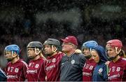 24 August 2014; Galway manager Tony Ward stands amongst his players during the playing of the national anthem. Liberty Insurance All-Ireland Senior Camogie Championship Semi-Final, Galway v Kilkenny. Gaelic Grounds, Limerick. Picture credit: Diarmuid Greene / SPORTSFILE