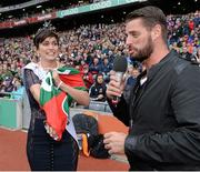 24 August 2014; Rose of Tralee Maria Walsh puts on a signed Mayo jersey, in the company of MC Keith Duffy, representing Irish Autism, during half-time as part of the GAA Inclusion Day. GAA Football All-Ireland Senior Championship, Semi-Final, Kerry v Mayo, Croke Park, Dublin. Picture credit: Brendan Moran / SPORTSFILE