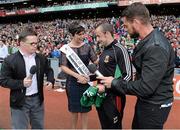 24 August 2014; Rose of Tralee Maria Walsh is presented with a signed Mayo jersey by Aiden McLoughlin, PRO, Mayo County Board, in the company of MC's Michael Gannon, left, representing Down Syndrome Ireland, and Keith Duffy, representing Irish Autism, during half-time as part of the GAA Inclusion Day. GAA Football All-Ireland Senior Championship, Semi-Final, Kerry v Mayo, Croke Park, Dublin. Picture credit: Brendan Moran / SPORTSFILE