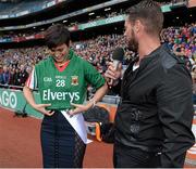 24 August 2014; Rose of Tralee Maria Walsh puts on a signed Mayo jersey, in the company of MC Keith Duffy, representing Irish Autism, during half-time as part of the GAA Inclusion Day. GAA Football All-Ireland Senior Championship, Semi-Final, Kerry v Mayo, Croke Park, Dublin. Picture credit: Brendan Moran / SPORTSFILE