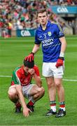 24 August 2014; Liam Byrne, wearing a Kerry jersey, comforts his Mayo team mate Brian Reape after the game.  Electric Ireland GAA Football All-Ireland Minor Championship, Semi-Final, Kerry v Mayo, Croke Park, Dublin. Picture credit: Ray McManus / SPORTSFILE