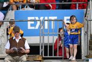 23 August 2014; A young Clare supporter waits to take her seat. Bord Gáis Energy GAA Hurling Under 21 All-Ireland Championship, Semi-Final, Clare v Antrim, Semple Stadium, Thurles, Co. Tipperary. Picture credit: Stephen McCarthy / SPORTSFILE