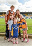 23 August 2014; Clare hurler Padraic Collins with the four cousins from Ennis, Co. Clare, left to right, Abbie Coll, aged 6, Aisling Coll, aged 3, Caoimhe Coll, aged 10, and Orlaith Coll, aged 8. Bord Gáis Energy GAA Hurling Under 21 All-Ireland Championship, Semi-Final, Clare v Antrim, Semple Stadium, Thurles, Co. Tipperary. Picture credit: Diarmuid Greene / SPORTSFILE