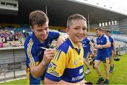 23 August 2014; Shane Kavanagh, aged 11, from Scariff, Co. Clare, gets his jersey signed by Clare's Tony Kelly after the game. Bord Gáis Energy GAA Hurling Under 21 All-Ireland Championship, Semi-Final, Clare v Antrim, Semple Stadium, Thurles, Co. Tipperary. Picture credit: Diarmuid Greene / SPORTSFILE