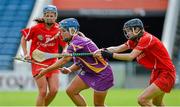 23 August 2014; Katrina Parrock, Wexford, in action against Pamela Mackey, right, and Una Leacy Cork. Liberty Insurance All-Ireland Senior Camogie Championship Semi-Final, Cork v Wexford, Semple Stadium, Thurles, Co. Tipperary. Picture credit: Diarmuid Greene / SPORTSFILE