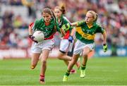 24 August 2014; Aoife Geraghty, Scoil Phádraig, Westport, Mayo, representing Mayo, in action against Ella Whelan, Killoughteen N.S, Newcastle West, Limerick, representing Kerry. INTO/RESPECT Exhibition GoGames, Croke Park, Dublin. Picture credit: Stephen McCarthy / SPORTSFILE