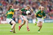 24 August 2014; Aoife Geraghty, Scoil Phádraig, Westport, Mayo, representing Mayo, in action against Ella Whelan, Killoughteen N.S, Newcastle West, Limerick,left, and Clara Coffey, St Oliver’s N.S, Heywood Road, Clonmel, Tipperary, representing Kerry. INTO/RESPECT Exhibition GoGames, Croke Park, Dublin. Picture credit: Stephen McCarthy / SPORTSFILE