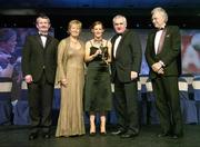 18 November 2006; Caoimhe Marley, Armagh, receives her All-Star award from An Taoiseach Bertie Ahern, TD, in the company of, from left, Pol O Gallchoir, Ceannsai, TG4, Geraldine Giles, President, Cumann Peil Gael na mBan, and Tony Towell, Managing Director O'Neills, at the 2006 TG4 / O'Neills Ladies Gaelic Football All-Star Awards. Citywest Hotel, Dublin. Picture credit: Brendan Moran / SPORTSFILE