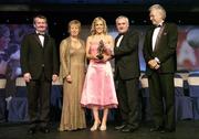 18 November 2006; Angela Walsh, Cork, receives her All-Star award from An Taoiseach Bertie Ahern, TD, in the company of, from left, Pol O Gallchoir, Ceannsai, TG4, Geraldine Giles, President, Cumann Peil Gael na mBan, and Tony Towell, Managing Director O'Neills, at the 2006 TG4 / O'Neills Ladies Gaelic Football All-Star Awards. Citywest Hotel, Dublin. Picture credit: Brendan Moran / SPORTSFILE
