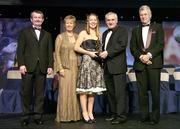 18 November 2006; Rena Buckley, Cork, receives her All-Star award from An Taoiseach Bertie Ahern, TD, in the company of, from left, Pol O Gallchoir, Ceannsai, TG4, Geraldine Giles, President, Cumann Peil Gael na mBan, and Tony Towell, Managing Director O'Neills, at the 2006 TG4 / O'Neills Ladies Gaelic Football All-Star Awards. Citywest Hotel, Dublin. Picture credit: Brendan Moran / SPORTSFILE