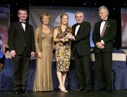 18 November 2006; Patricia Fogarty, Laois, receives her All-Star award from An Taoiseach Bertie Ahern, TD, in the company of, from left, Pol O Gallchoir, Ceannsai, TG4, Geraldine Giles, President, Cumann Peil Gael na mBan, and Tony Towell, Managing Director O'Neills, at the 2006 TG4 / O'Neills Ladies Gaelic Football All-Star Awards. Citywest Hotel, Dublin. Picture credit: Brendan Moran / SPORTSFILE