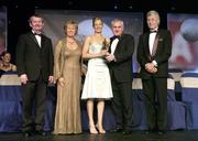 18 November 2006; Mary O'Donnell, Waterford, receives her All-Star award from An Taoiseach Bertie Ahern, TD, in the company of, from left, Pol O Gallchoir, Ceannsai, TG4, Geraldine Giles, President, Cumann Peil Gael na mBan, and Tony Towell, Managing Director O'Neills, at the 2006 TG4 / O'Neills Ladies Gaelic Football All-Star Awards. Citywest Hotel, Dublin. Picture credit: Brendan Moran / SPORTSFILE