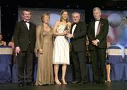 18 November 2006; Grainne Nulty, Meath, receives her All-Star award from An Taoiseach Bertie Ahern, TD, in the company of, from left, Pol O Gallchoir, Ceannsai, TG4, Geraldine Giles, President, Cumann Peil Gael na mBan, and Tony Towell, Managing Director O'Neills, at the 2006 TG4 / O'Neills Ladies Gaelic Football All-Star Awards. Citywest Hotel, Dublin. Picture credit: Brendan Moran / SPORTSFILE