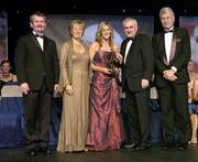 18 November 2006; Sarah O'Connor, Kerry, receives her All-Star award from An Taoiseach Bertie Ahern, TD, in the company of, from left, Pol O Gallchoir, Ceannsai, TG4, Geraldine Giles, President, Cumann Peil Gael na mBan, and Tony Towell, Managing Director O'Neills, at the 2006 TG4 / O'Neills Ladies Gaelic Football All-Star Awards. Citywest Hotel, Dublin. Picture credit: Brendan Moran / SPORTSFILE