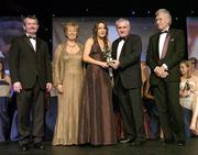 18 November 2006; Tracey Lawlor, Laois, receives her All-Star award from An Taoiseach Bertie Ahern, TD, in the company of, from left, Pol O Gallchoir, Ceannsai, TG4, Geraldine Giles, President, Cumann Peil Gael na mBan, and Tony Towell, Managing Director O'Neills, at the 2006 TG4 / O'Neills Ladies Gaelic Football All-Star Awards. Citywest Hotel, Dublin. Picture credit: Brendan Moran / SPORTSFILE