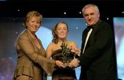 18 November 2006; Ciara McAnespie, Monaghan, receives her Ulster Young Player of the Year award from An Taoiseach Bertie Ahern, TD, and Geraldine Giles, President, Cumann Peil Gael na mBan, at the 2006 TG4 / O'Neills Ladies Gaelic Football All-Star Awards. Citywest Hotel, Dublin. Picture credit: Brendan Moran / SPORTSFILE
