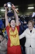 19 November 2006; Harps captain Denise Quigley lifts the McBride cup, in the company of Liz Howard, President, Cumann Camogaiochta na nGael. All-Ireland Junior Camogie Championship Final, Harps v Keady, O'Moore Park, Portlaoise, Co. Laois. Picture credit: Brian Lawless / SPORTSFILE