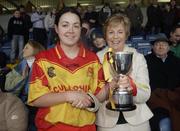 19 November 2006; Harps captain Denise Quigley is presented with the McBride cup by Liz Howard, President, Cumann Camogaiochta na nGael. All-Ireland Junior Camogie Championship Final, Harps v Keady, O'Moore Park, Portlaoise, Co. Laois. Picture credit: Brian Lawless / SPORTSFILE