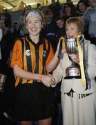 19 November 2006; St Lachtain's captain Margaret McCarthy is presented with the Bill Carroll cup by    Liz Howard, President, Cumann Camogaiochta na nGael. All-Ireland Senior Camogie Club Championship Final, St Lachtain's v O'Donovan Rossa, O'Moore Park, Portlaoise, Co. Laois. Picture credit: Brian Lawless / SPORTSFILE