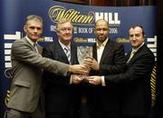 20 November 2006; Pictured at the announcement that 'Back from the Brink, the Paul McGrath autobiography, is the inaugrual winner of the William Hill Sports Book of the Year are; Minister for Art, Sport and Tourism, John O’Donoghue, T.D., Paul McGrath, Irish Independent journalist Vincent Hogan, left, and David Hood, right, William Hill. The award was presented in Easons Bookstore, Dawson Street, Dublin. Picture credit: Ray McManus / SPORTSFILE