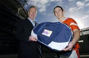 21 November 2006; Declan Moran, Director of Marketing and Business Development, Vhi healthcare, presents a kit bag to Fiona Courtney, captain of Donaghmoyne, Co. Monaghan, pictured at the Vhi Healthcare All-Ireland Ladies Club Final Captains Day. Croke Park, Dublin. Picture credit: David Maher / SPORTSFILE