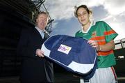 21 November 2006; Declan Moran, Director of Marketing and Business Development, Vhi healthcare, presents a kit bag to Martha Carter, captain of Carnacon, Co. Mayo, pictured at the Vhi Healthcare All-Ireland Ladies Club Final Captains Day. Croke Park, Dublin. Picture credit: David Maher / SPORTSFILE