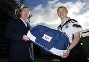 21 November 2006; Declan Moran, Director of Marketing and Business Development, Vhi healthcare, presents a kit bag to Patrica McKenna, captain Emyvale, Co. Monaghan, pictured at the Vhi Healthcare All-Ireland Ladies Club Final Captains Day. Croke Park, Dublin. Picture credit: David Maher / SPORTSFILE