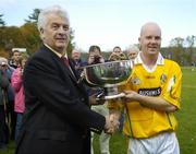 22 October 2006; Antrim captain Karl McKeegan is presented with the Liam Harvey Cup by Michael Greenan, Chairman of the Ulster Council. Guinness Ulster Senior Hurling Final, Antrim v New York, Irish Cultural Centre, Canton, Boston, USA. Picture credit: Brendan Moran / SPORTSFILE
