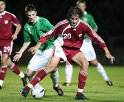 11 October 2006; Girts Karlsons, Latvia, in action against Chris Baird, Northern Ireland. Euro 2008 Championship Qualifier, Northern Ireland v Latvia, Windsor Park, Belfast. Picture credit: Oliver McVeigh / SPORTSFILE