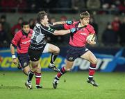 25 November 2006; Shaun Payne, Munster, is tackled by Tal Selley, Neath Swansea Ospreys. Magners League, Munster v Neath Swansea Ospreys, Thomond Park, Limerick. Picture credit: Kieran Clancy / SPORTSFILE