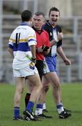 26 November 2006; James Conway, Ballinderry, laughs at Pascal Canavan as Referee Pat McAneaney tells him he is being sent off. AIB Ulster Club Senior Football Championship Semi-Final Replay, Errigal Chiarain v Ballinderry, Casement Park, Belfast, Co. Antrim. Picture credit: Russell Pritchard / SPORTSFILE