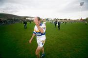 26 November 2006; Peter Canavan, Errigal Chiarain, covers his face from photographers as he leaves the pitch. AIB Ulster Club Senior Football Championship Semi-Final Replay, Errigal Chiarain v Ballinderry, Casement Park, Belfast, Co. Antrim. Picture credit: Russell Pritchard / SPORTSFILE