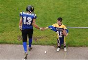 9 August 2009; UL Vikings Wide Receiver Marc Ashworth hi fives a young fan as he makes his way onto the pitch before the game. The Vikings won the game 9-6 after sudden death extra time. Shamrock Bowl XXIII, University of Limerick Vikings v Dublin Rebels, Cooke RFC, Shaws Bridge Belfast. Picture credit: Brendan Moran / SPORTSFILE