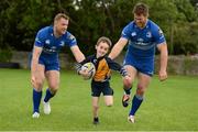 27 August 2014; At the announcement that Bank of Ireland has extended its sponsorship of  Leinster Rugby until end of June 2019 are Leinster's Jamie Heaslip, left, and Sean O'Brien with Sean Murphy, age 7, from Clondalkin RFC, Dublin. The new five year deal includes exclusive branding of all playing and training kits for the Leinster Rugby professional team and will see Bank of Ireland expand the sponsorship to make a significant additional six figure investment, over five years, to develop the amateur game. The new agreement strengthens Bank of Ireland’s support for Leinster Rugby as it includes support for grass roots level right up to the professional senior team. Clondalkin RFC, Clondalkin, Co. Dublin. Picture credit: Barry Cregg / SPORTSFILE