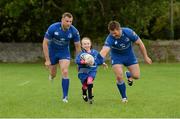 27 August 2014; At the announcement that Bank of Ireland has extended its sponsorship of  Leinster Rugby until end of June 2019 are Leinster's Jamie Heaslip, left, and Sean O'Brien, with Clodagh Grenham, age 7, from Clondalkin RFC, Dublin. The new five year deal includes exclusive branding of all playing and training kits for the Leinster Rugby professional team and will see Bank of Ireland expand the sponsorship to make a significant additional six figure investment, over five years, to develop the amateur game. The new agreement strengthens Bank of Ireland’s support for Leinster Rugby as it includes support for grass roots level right up to the professional senior team. Clondalkin RFC, Clondalkin, Co. Dublin. Picture credit: Barry Cregg / SPORTSFILE
