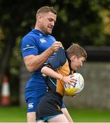 27 August 2014; At the announcement that Bank of Ireland has extended its sponsorship of  Leinster Rugby until end of June 2019 are Leinster's Jamie Heaslip, with CJ Bergin, age 10, from Clondalkin RFC. The new five year deal includes exclusive branding of all playing and training kits for the Leinster Rugby professional team and will see Bank of Ireland expand the sponsorship to make a significant additional six figure investment, over five years, to develop the amateur game. The new agreement strengthens Bank of Ireland’s support for Leinster Rugby as it includes support for grass roots level right up to the professional senior team. Clondalkin RFC, Clondalkin, Co. Dublin. Picture credit: David Maher / SPORTSFILE