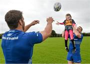 27 August 2014; At the announcement that Bank of Ireland has extended its sponsorship of  Leinster Rugby until end of June 2019 are Leinster's Jamie Heaslip and Sean O'Brien with Clodagh Grenham, age 7, from Clondalkin RFC. The new five year deal includes exclusive branding of all playing and training kits for the Leinster Rugby professional team and will see Bank of Ireland expand the sponsorship to make a significant additional six figure investment, over five years, to develop the amateur game. The new agreement strengthens Bank of Ireland’s support for Leinster Rugby as it includes support for grass roots level right up to the professional senior team. Clondalkin RFC, Clondalkin, Co. Dublin. Picture credit: David Maher / SPORTSFILE