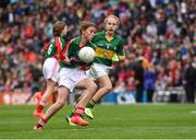 24 August 2014; Kayla Butler, Holy Cross N.S, Ballycamane, Tramore, Waterford, representing Mayo, in action against Ella Whelan, Killoughteen N.S, Newcastle West, Limerick, representing Kerry. INTO/RESPECT Exhibition GoGames, Croke Park, Dublin. Picture credit: Ray McManus / SPORTSFILE